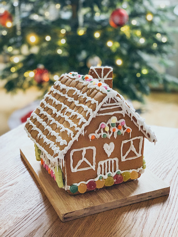 Homemade Christmas gingerbread house with Christmas decorations kit
