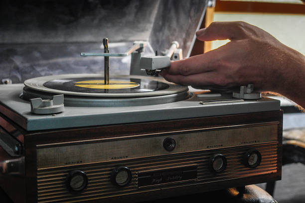istock Retro record player with 33 rpm records seen from the side. 1443081448