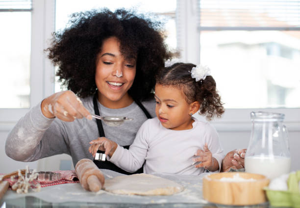 istock Mother and daughter are baking together 1443082569