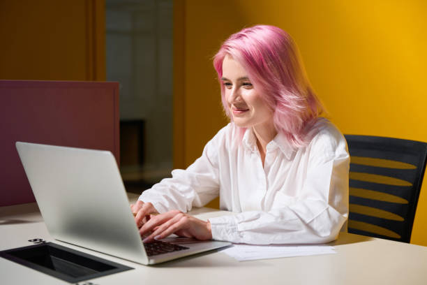 istock Pretty female working online during quarantine in coworking 1443083689