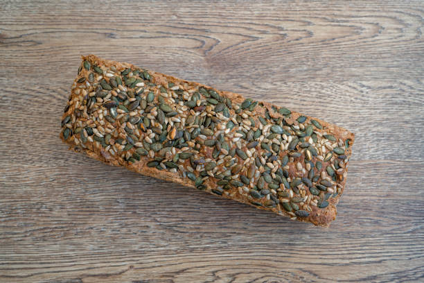 istock whole grain bread on a wooden table 1443085976
