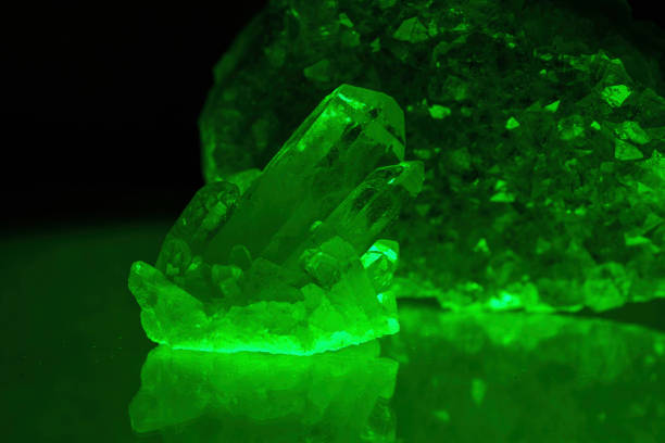 istock Quartz with mineral crystals against a black background 1443087609