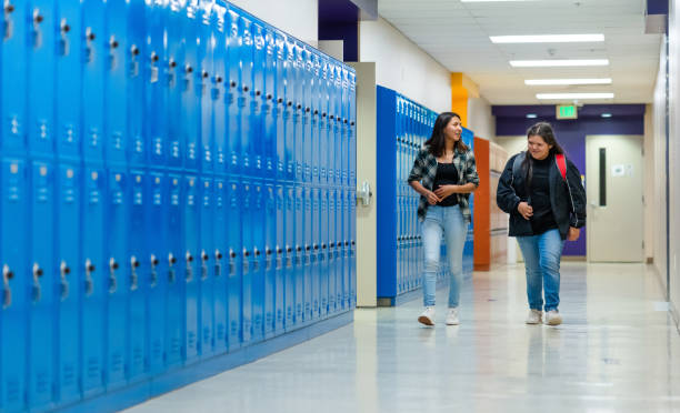 istock Female students walking on a corridor at high school in Monument Valley 1443089770