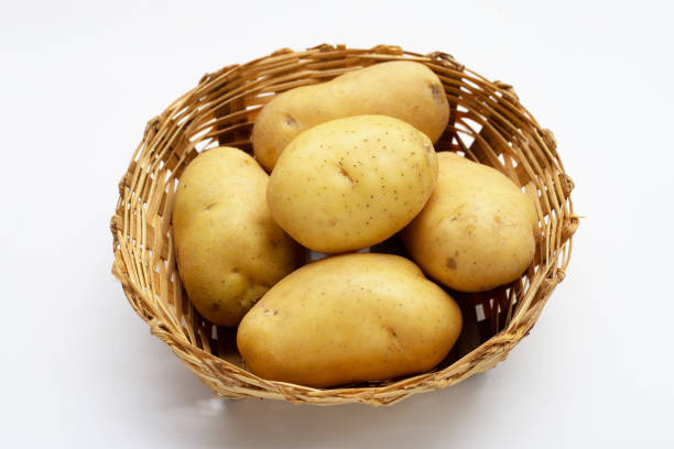 istock Raw potatoes isolated on white background 1443091605