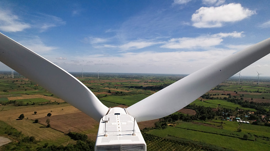 Close up Wind Turbines Windmill Energy generator ,Aerial view of wind turbines and agriculture field