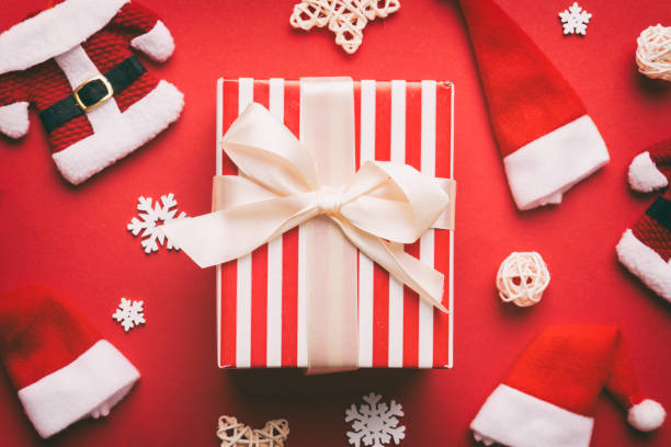istock Christmas composition. Gifts box with new year decorations on colored background. Christmas, winter, new year concept. Flat lay, top view, copy space 1443102731