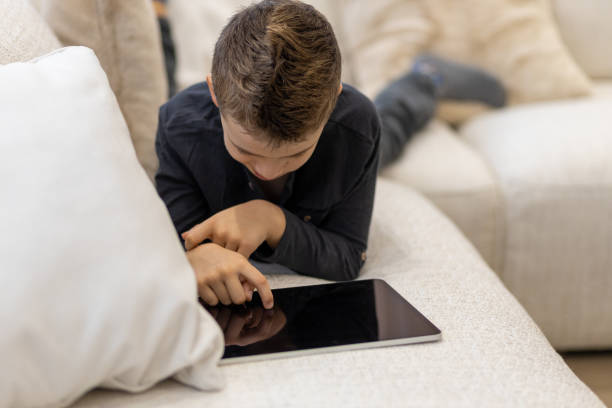 istock Child playing video games on an iPad 1443103948