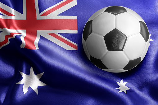 Soccer ball on flag of Australia. Horizontal orientation. No people.