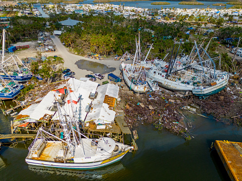Fort Myers Beach, FL, USA - November 19, 2022: Boats lay waste after Hurricane Ian aftermath and storm surge