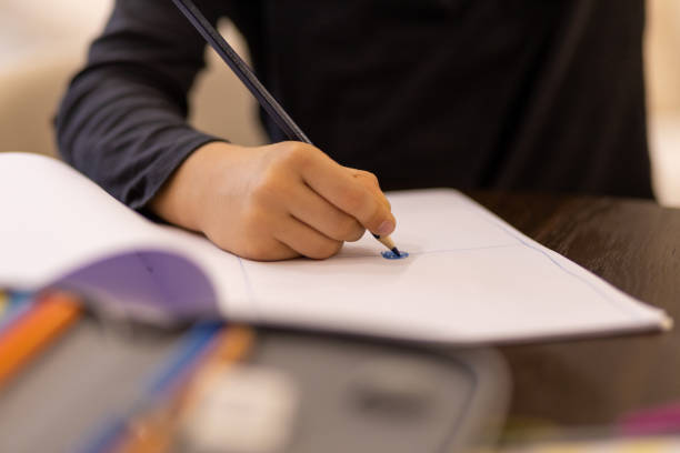istock Close-up of a young boy drawing 1443104288
