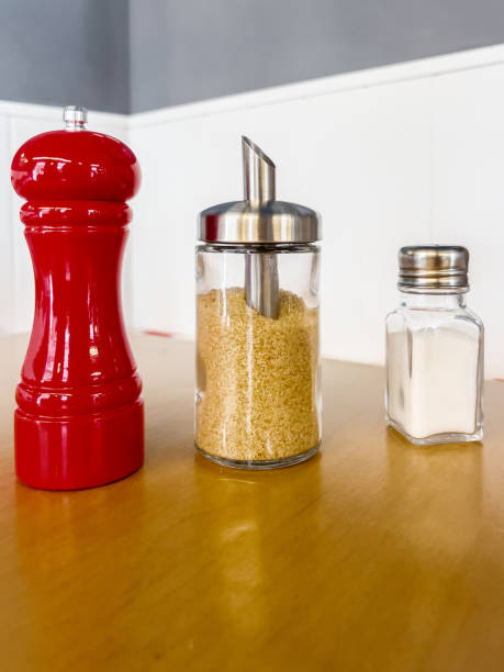 istock Salt, pepper and brown sugar in modern dispensers. 1443104819