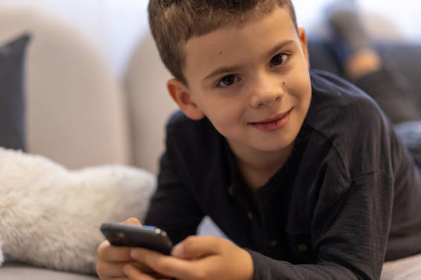 istock Cute young boy looking at the camera 1443105661