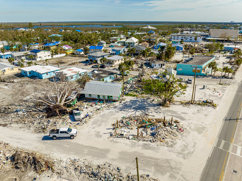 Aerial drone photo streets full of debris from Hurricane Ian aftermath