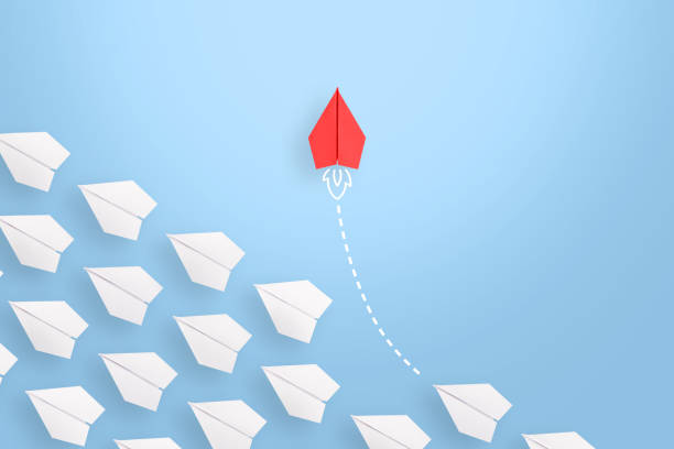 istock Change concepts with red paper airplane leading among white 1443110101