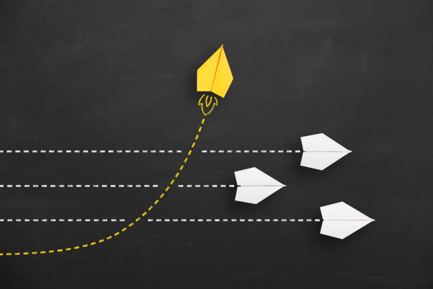 istock Change concepts with yellow paper airplane leading among white 1443110178