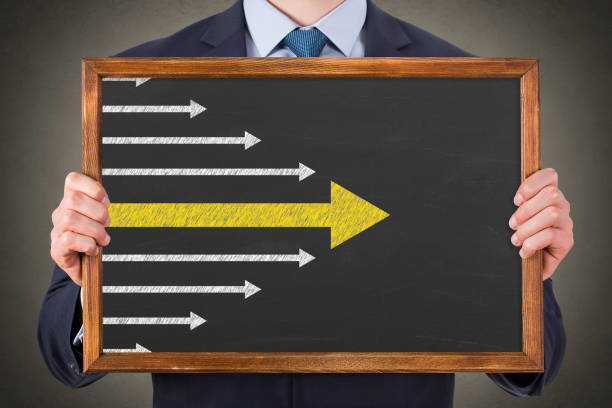 Leadership Concepts with Arrows on Chalkboard Background