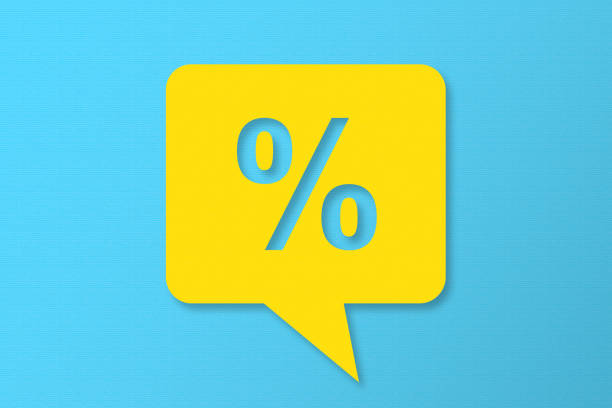 Percentage Sign Speech Bubbles with Copy Space On Blue Cardboard Background