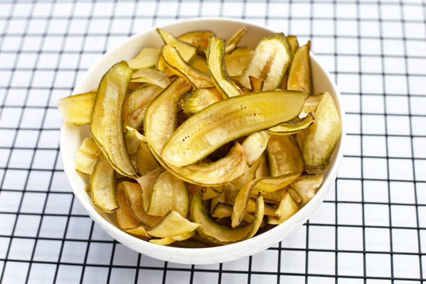 istock Green banana chips with peel 1443112926