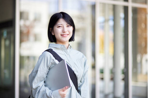 istock Young Japanese college student enjoying campus life 1443126224