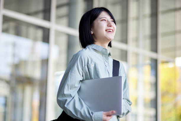istock Young Japanese college student enjoying campus life 1443126245