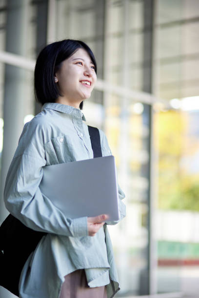 istock Young Japanese college student enjoying campus life 1443126288