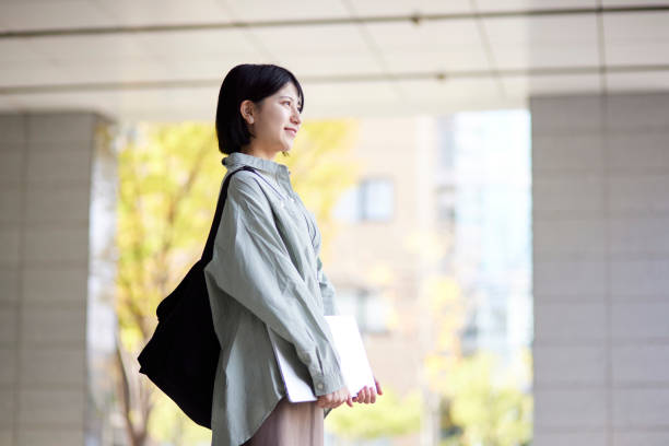 istock Young Japanese college student enjoying campus life 1443126435