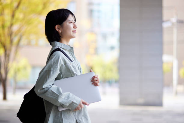 istock Young Japanese college student enjoying campus life 1443126455