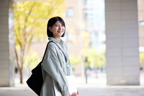 Young Japanese college student enjoying campus life