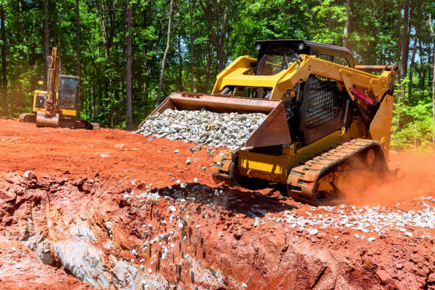istock As the bobcat mini loader is delivering crushed stone to the drainage pit, it falls asleep 1443126475