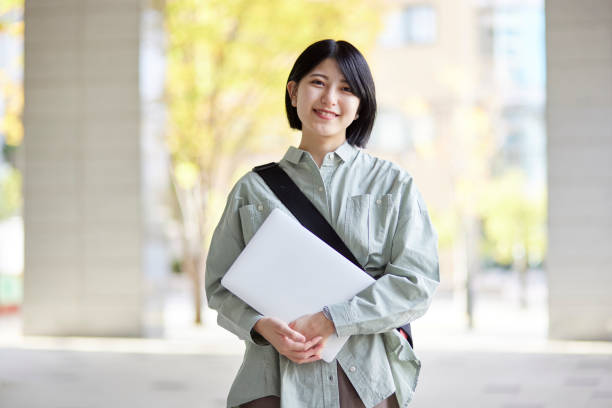istock Young Japanese college student enjoying campus life 1443126522