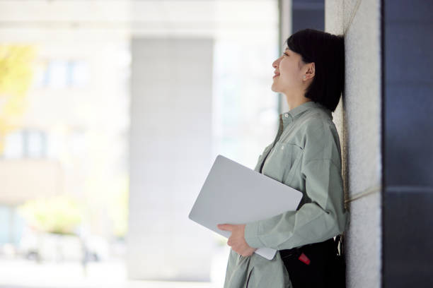 istock Young Japanese college student enjoying campus life 1443126682