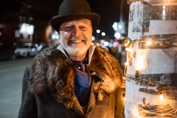 istock Mature man singing Christmas carols outdoors at night 1443127779