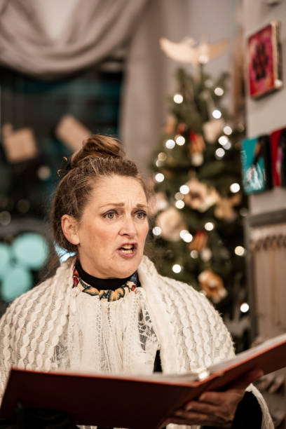 istock Mature woman practising singing for Christmas carolling 1443127946