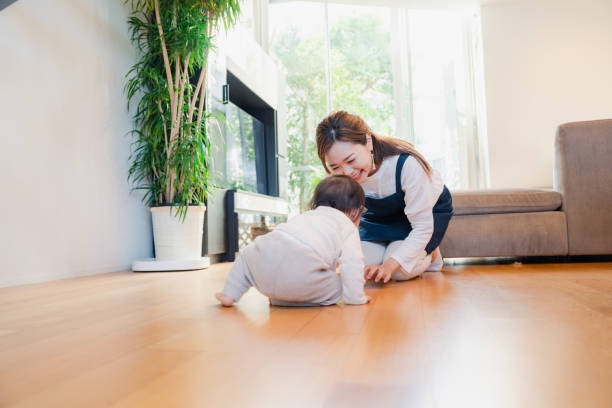 istock Babysitter taking care of baby 1443129761