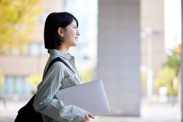 Young Japanese college student enjoying campus life