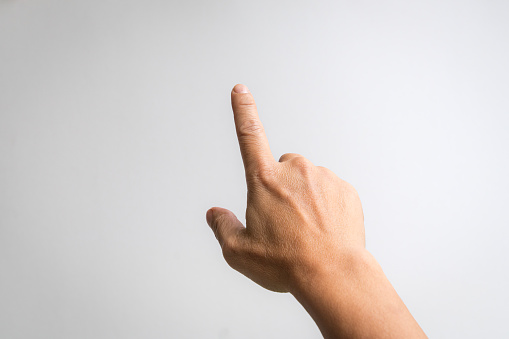 Male hand with index finger pointing to something. White background.