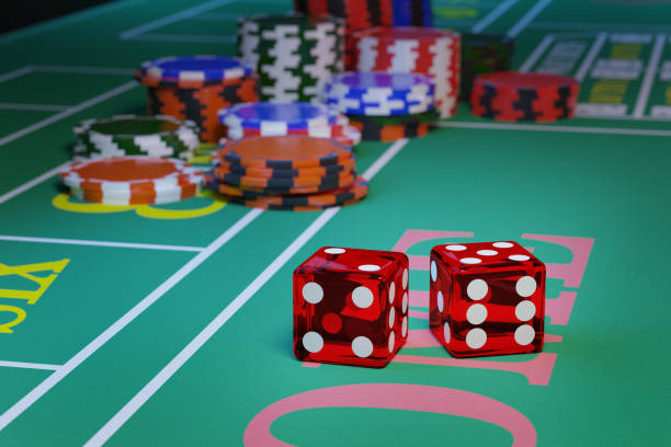 istock Close up of a pair of dice rolling down a craps table. Selective focus.Gambling concept. 3d illustration. 1443132321