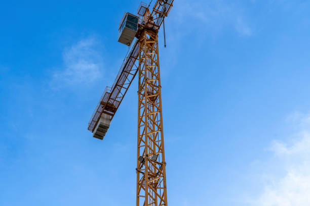 istock Construction site with cranes against blue sky. Industrial background. Modern skyscrapers. Unfinished construction 1443133314