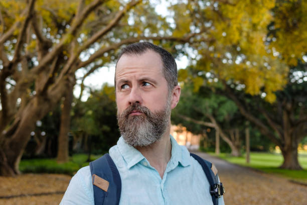istock A man looking to the side and thinking. 1443136675
