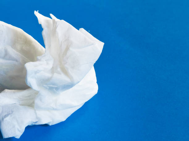 istock Image of used white tissue paper against blue background. 1443138277
