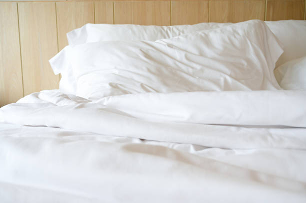 istock white bed and pillows in the room 1443140394