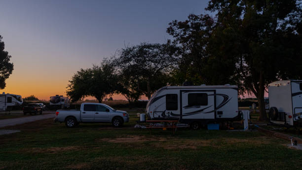 istock Camping in a small trailer with truck for towing 1443143999