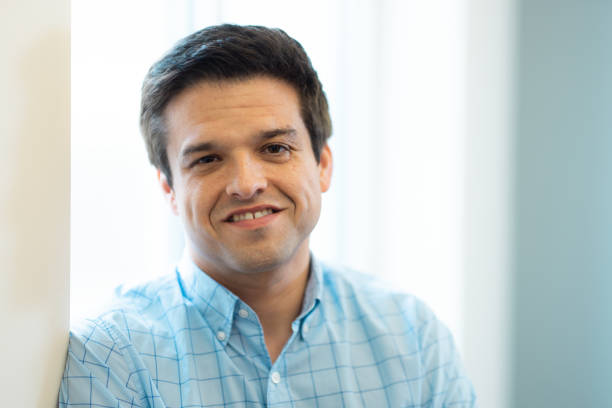 istock Portrait - Looking at Camera - Neutral Background - Relaxed Natural Smile - Confidence 1443144920