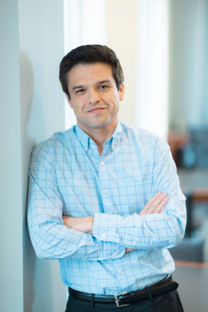 istock Portrait - Looking at Camera - Neutral Background - Relaxed Natural Smile - Confidence 1443145277