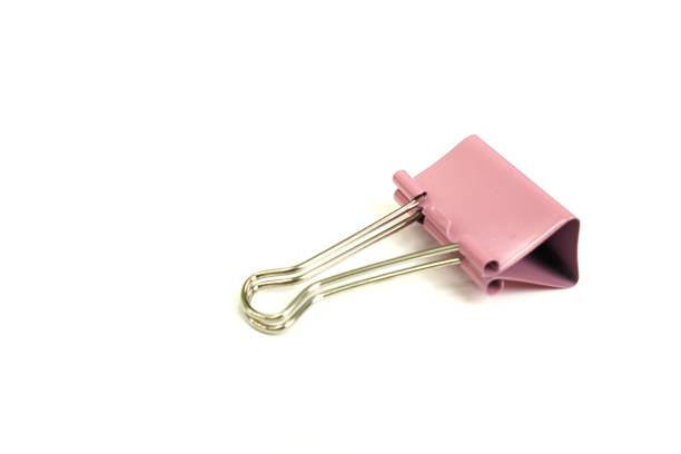 istock The figure shows a medium-sized pink binder paper clips, isolated. 1443156097