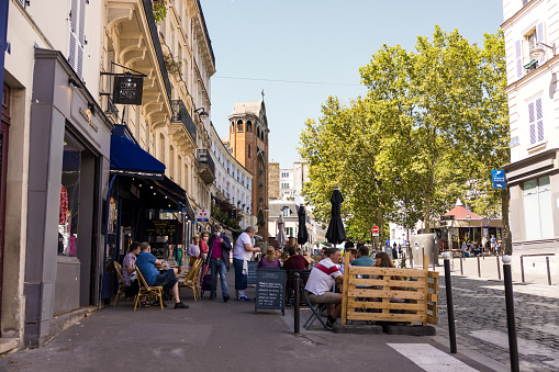 Paris, France – August 11, 2021: A closeup shot of cafes and restaurants on the street of Paris