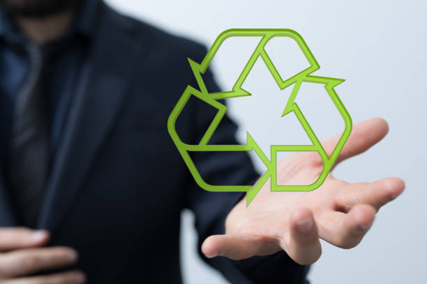 istock 3D rendered recycling sign hovering over a man's palm 1443170221