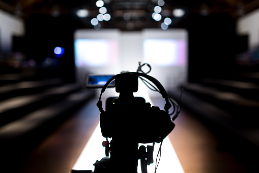 Television camera recording broadcasting a fashion show