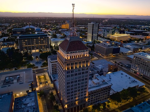 An aerial view of Fresno city illuminated at sunset