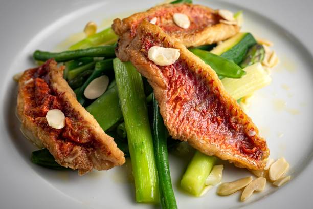 istock Closeup of roasted pork with celery served on a plate 1443171108